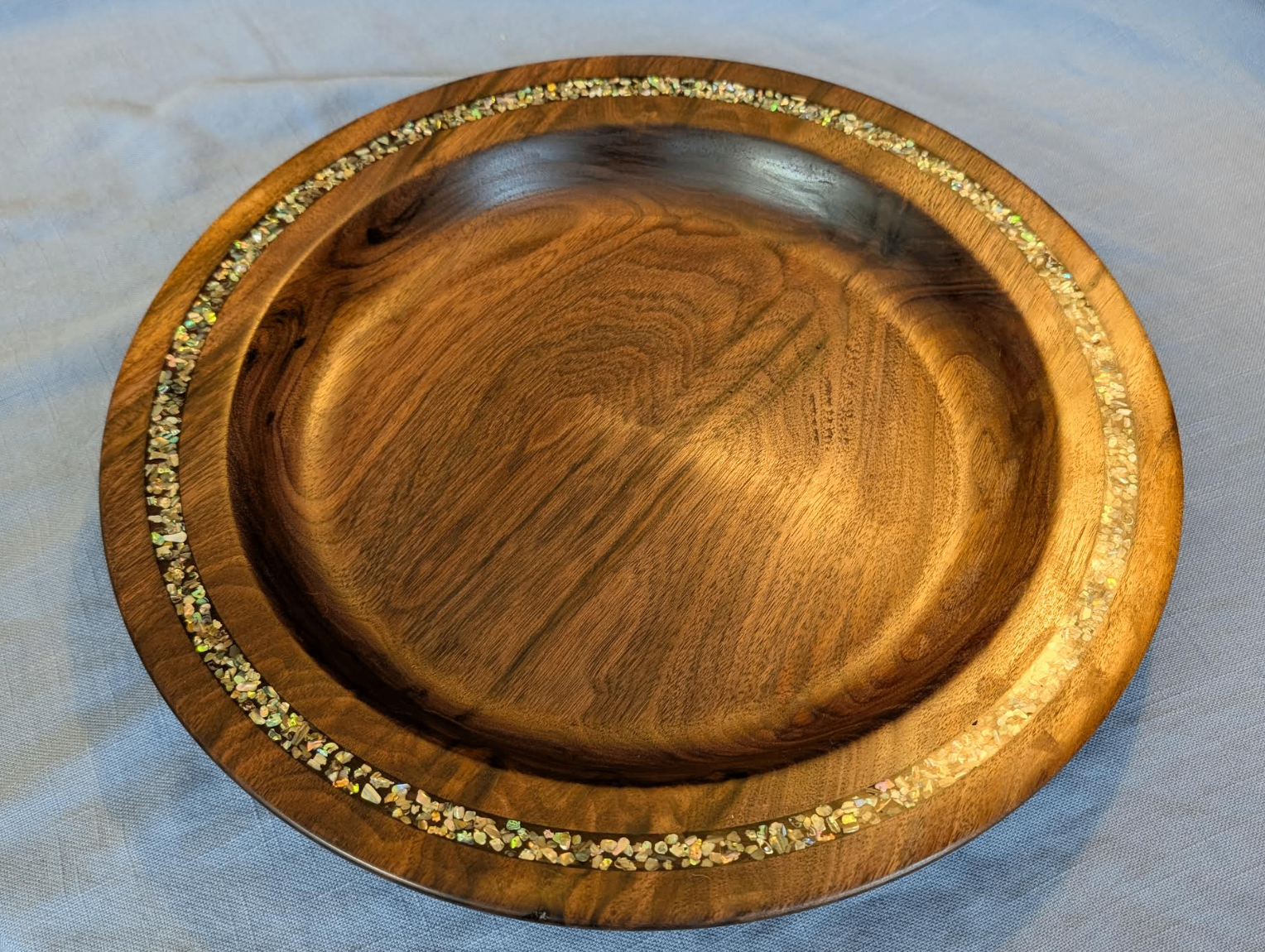 Walnut platter with crushed opal inlay around the rim