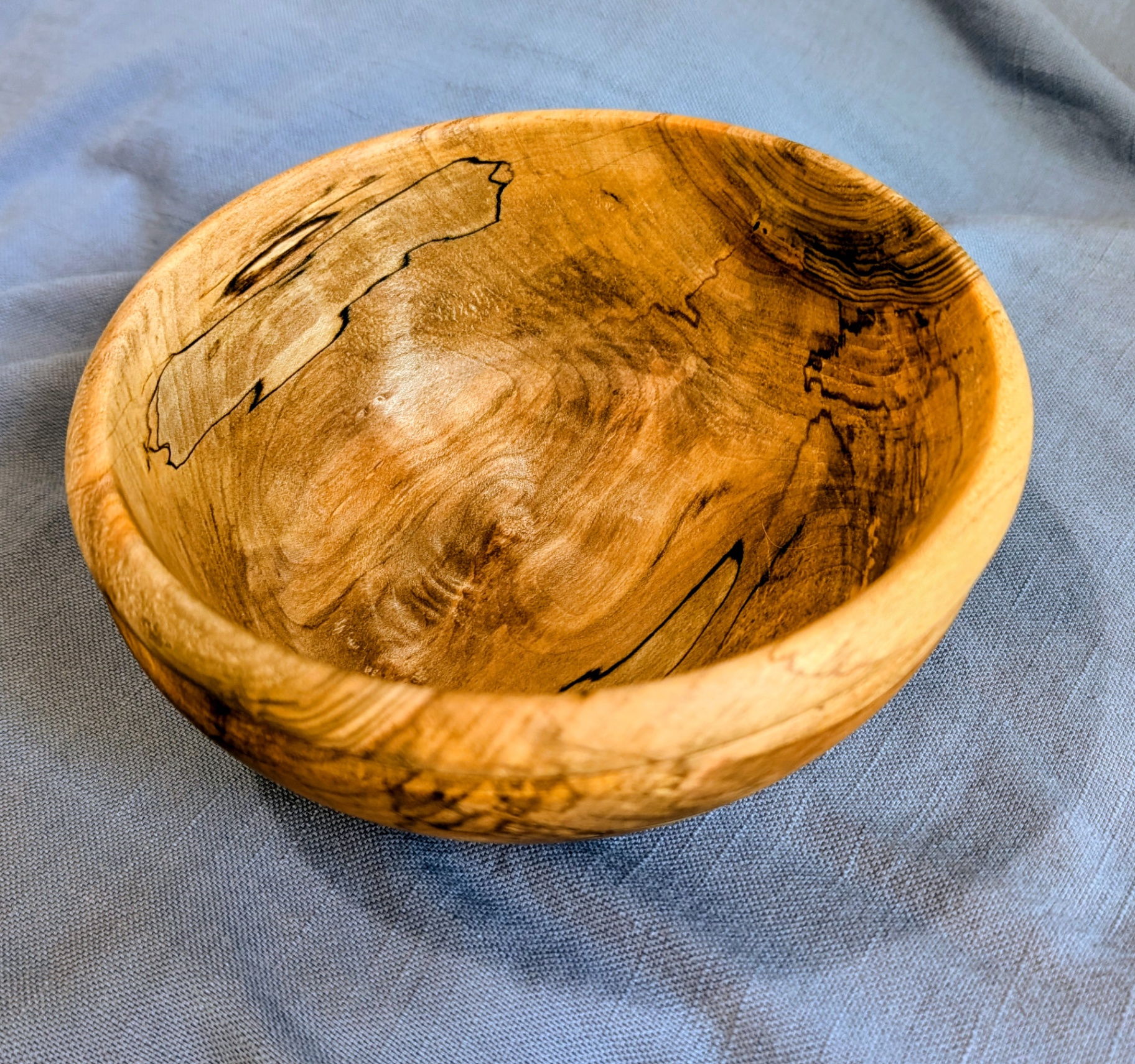 Cherry bowl with rolled rim, top view
