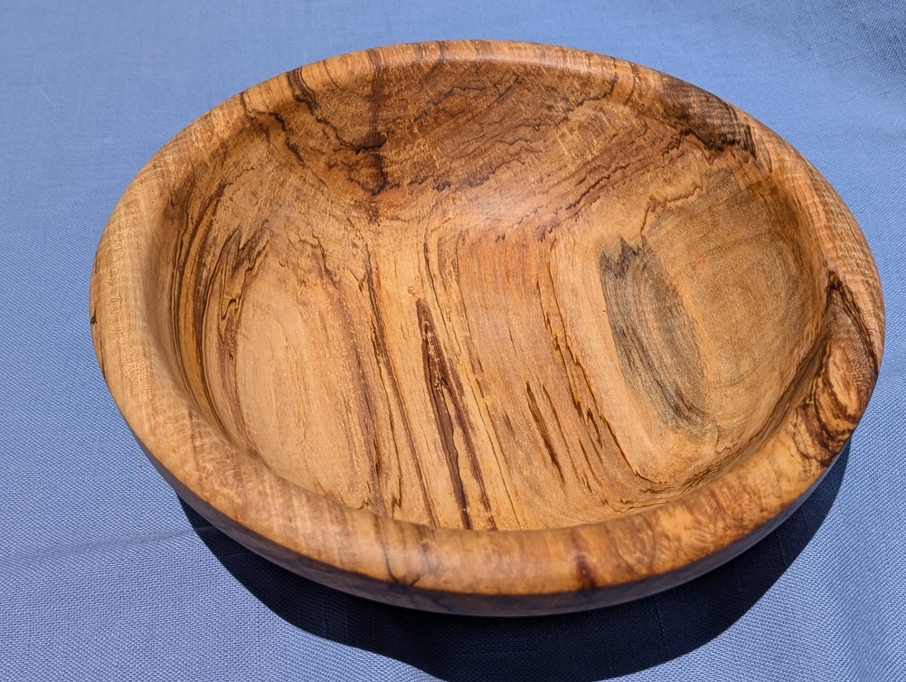 Spalted cherry bowl showing dramatic dark spalting lines across the interior